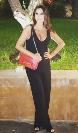 Elissa is enjoying a night out in Beirut completing her black cat-suit with an eye-catching red bag by Dior.